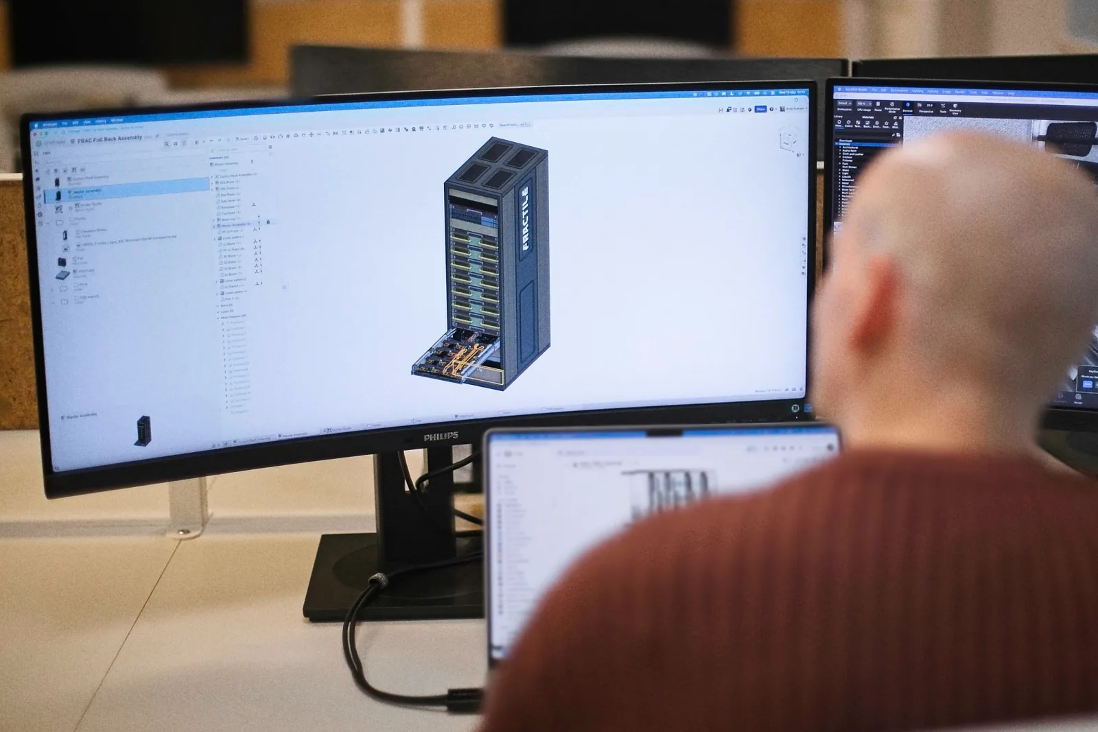 An Amodo engineer reviewing the Fractile full-rack assembly in CAD.