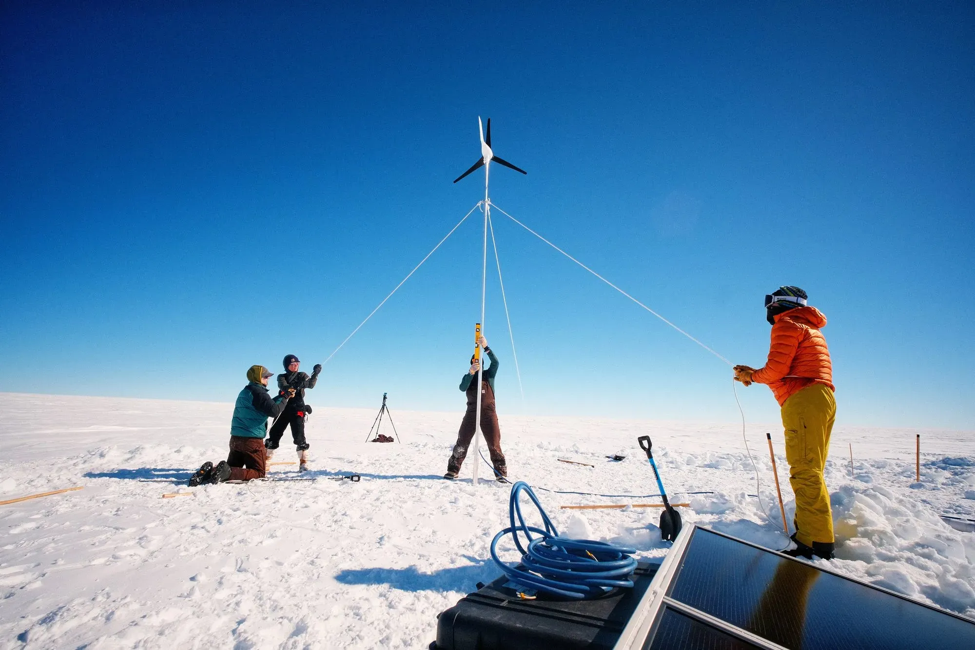 Field deployment of a wind-turbine power mast on the Arctic ice.